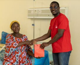 Zainab Issah receives a send-off package after Telecel Foundation cleared her medical bills at the Asante Akim Central Municipal Hospital in Konongo as part of 2025 Homecoming.