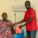 Zainab Issah receives a send-off package after Telecel Foundation cleared her medical bills at the Asante Akim Central Municipal Hospital in Konongo as part of 2025 Homecoming.