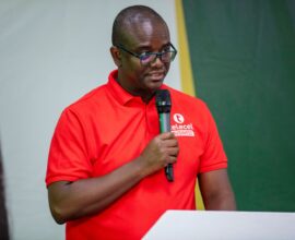 Telecel Ghana’s Head of SME, Alfred Neizer speaks at the 10th Rural Banking Week Celebration in Ho on strengthening financial participation.
