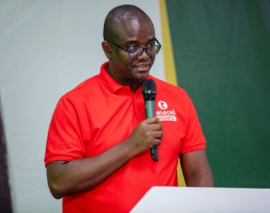 Telecel Ghana’s Head of SME, Alfred Neizer speaks at the 10th Rural Banking Week Celebration in Ho on strengthening financial participation.