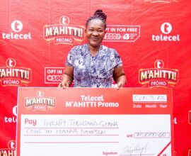 First weekly winner in Telecel M’ahitti Promo, Hannah Dampson receives her GH¢20,000 cash prize in Kumasi.
